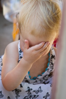 Image of young girl doing "face palm."
